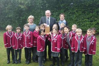 Charles Thwaites MBE presenting the award to Milbourne Lodge School