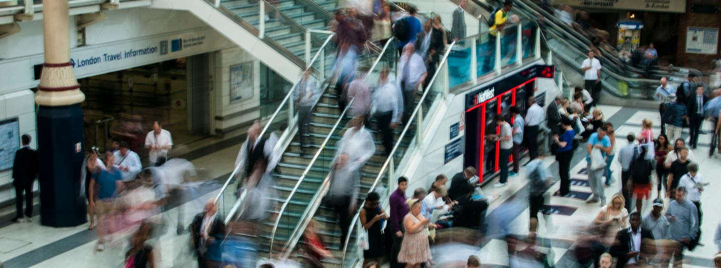 People at London train station (c) Anna Dziubinska via Unsplash