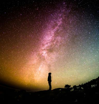 Figure with night sky (c) Greg Rakozy via Unsplash