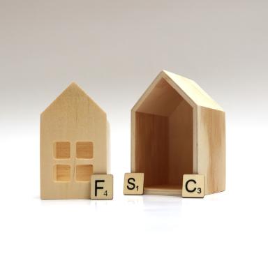 FSC-certified toy wooden house with wooden letters spelling 'FSC'